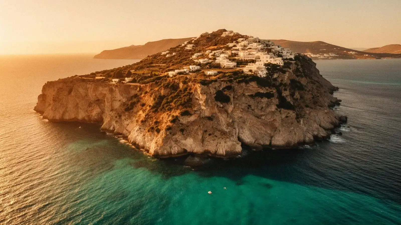 Dramatic Greek coastal cliff at golden hour